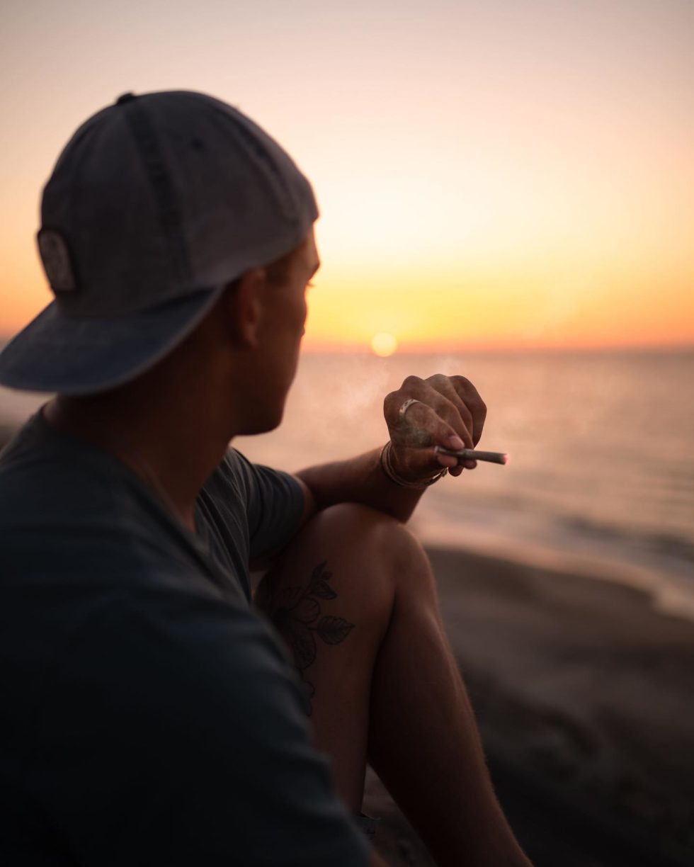 man enjoying a roll on the beach